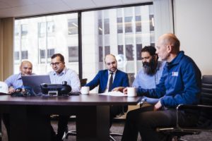 Electrical Project Engineers at work in boardroom