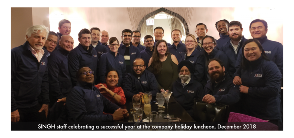 The Singh & Associates staff celebrating a successful year at the company holiday luncheon in December 2018